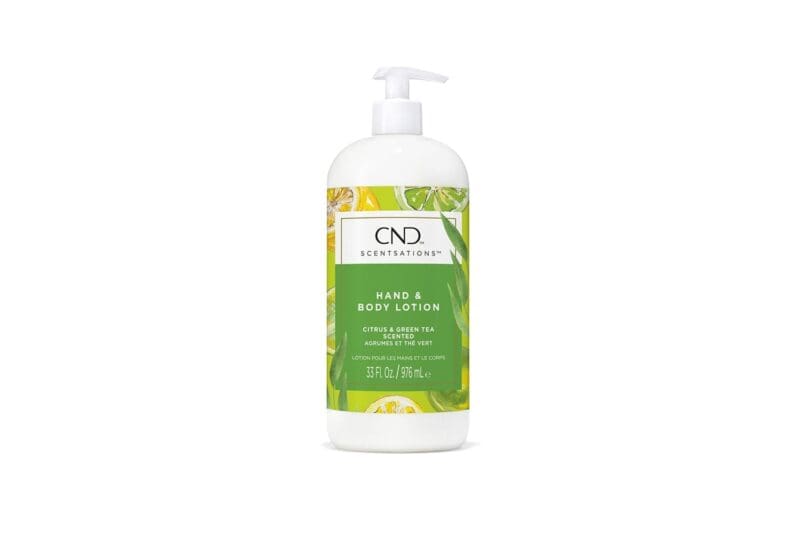 A bottle of CND Scentsations Hand & Body Lotion 33oz with a citrus and green tea scent. The bottle is white with a green label and a pump dispenser. The volume is 31 fl. oz. (915 mL).