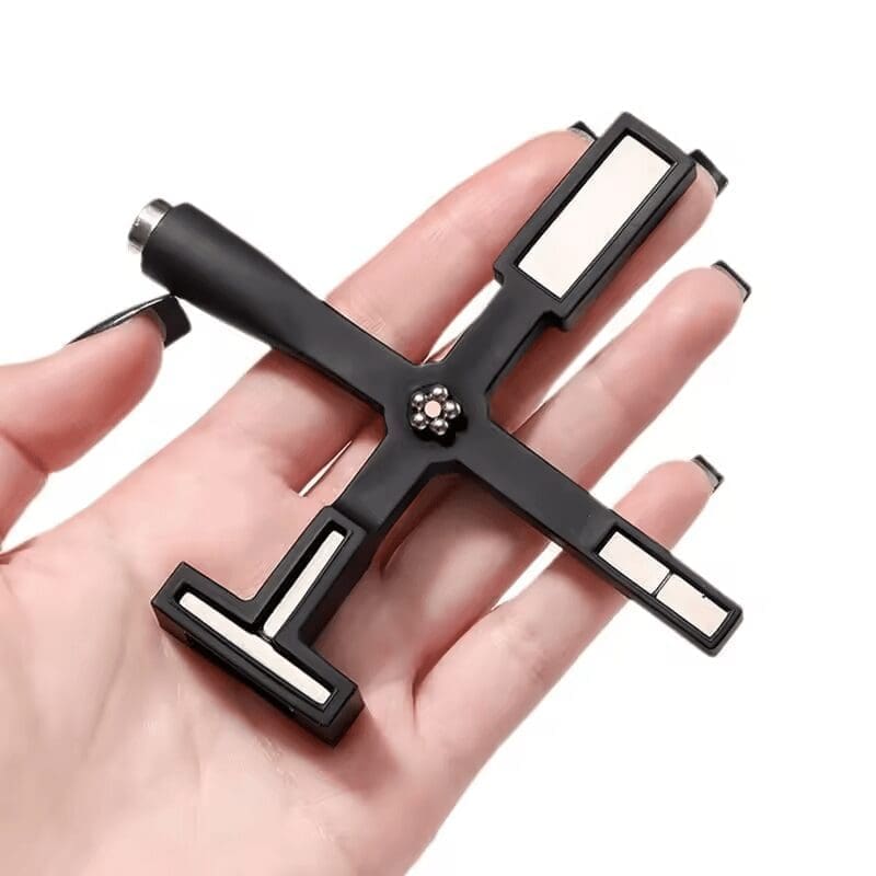 A hand holding a Multifunctional Cat Eye Magnet Stick with multiple socket heads.